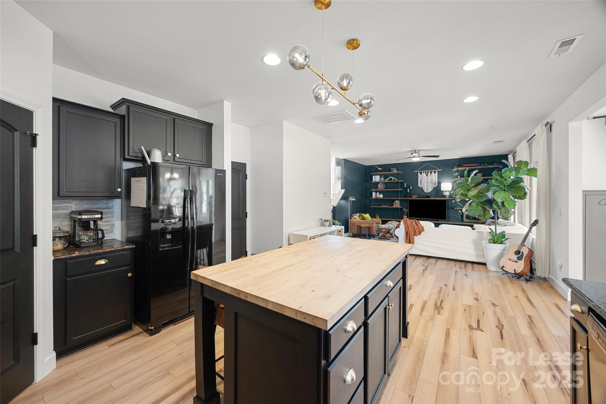 1668 Beleek Ridge Lane Clover, SC 29710 - Photo 9 of 42 a kitchen with kitchen island a counter top space a sink appliances and cabinets