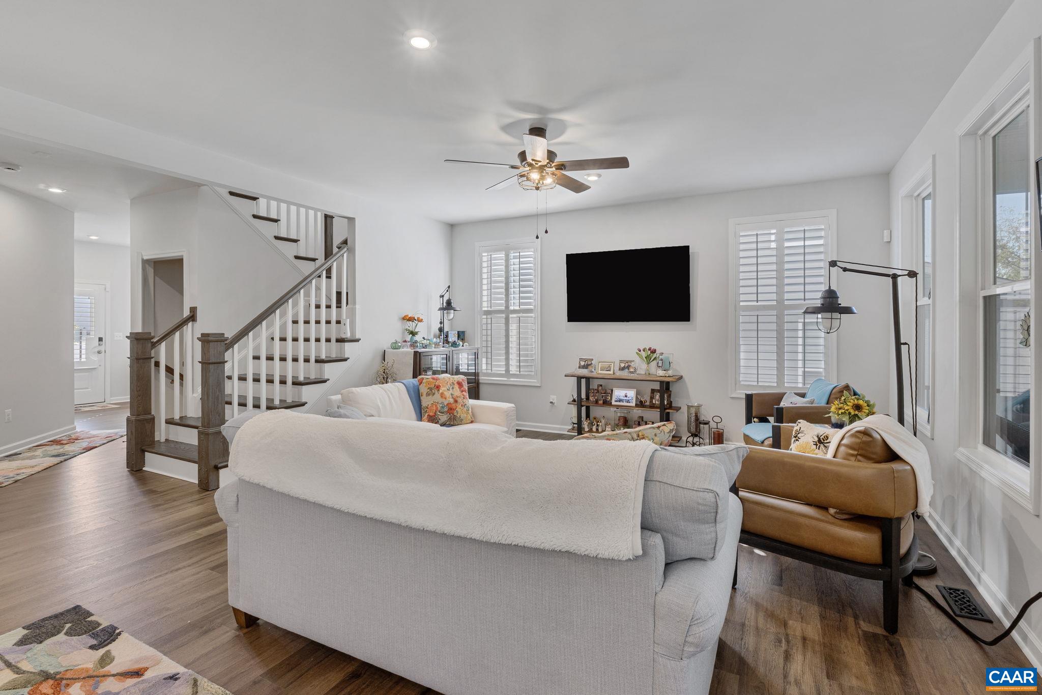 2879 Rambling Brook Lane Crozet, VA 22932 - Photo 11 of 63 a living room with furniture and a flat screen tv