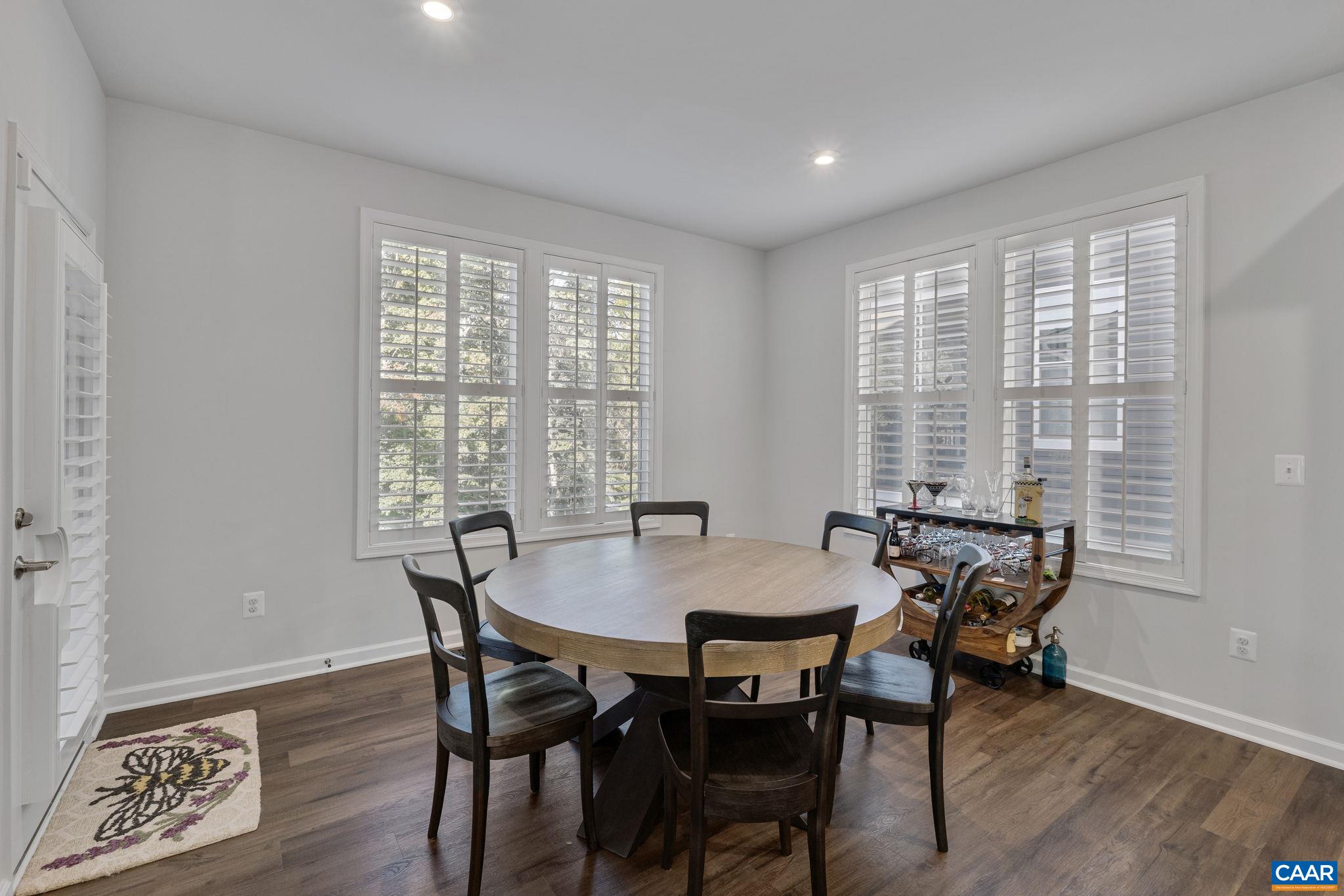 2879 Rambling Brook Lane Crozet, VA 22932 - Photo 16 of 63 a view of a dining room with furniture window and wooden floor