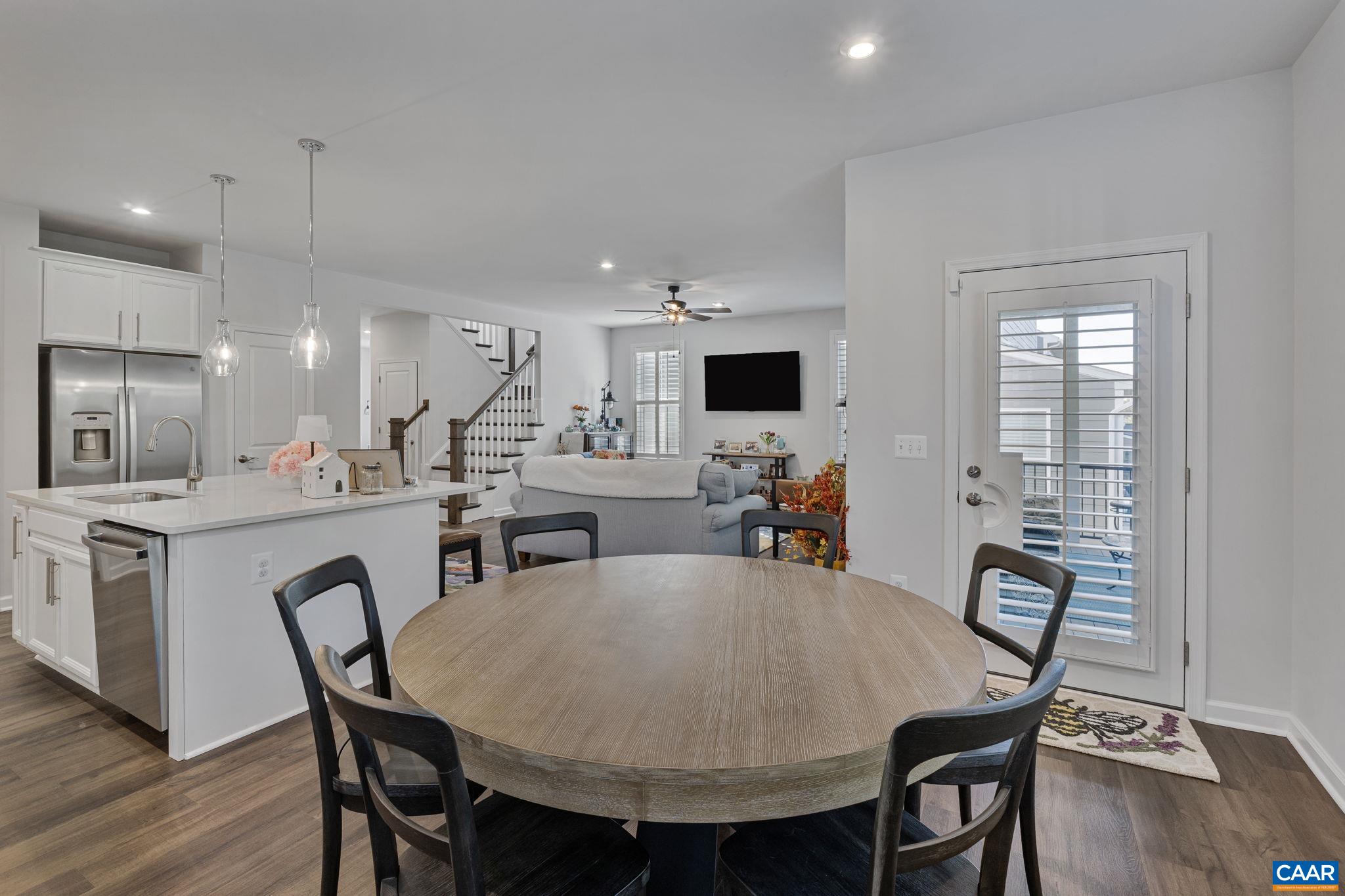2879 Rambling Brook Lane Crozet, VA 22932 - Photo 17 of 63 a view of a dining room with furniture and wooden floor