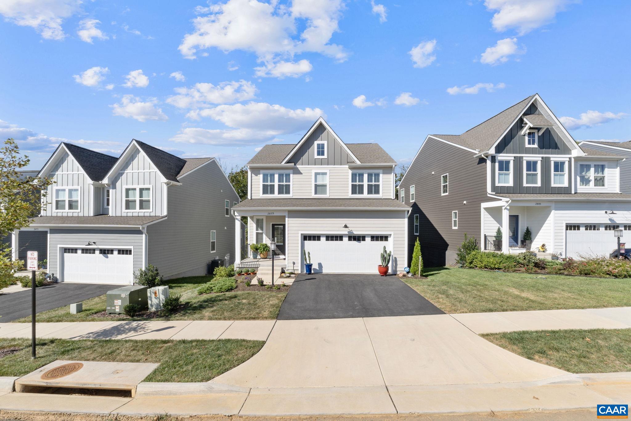 2879 Rambling Brook Lane Crozet, VA 22932 - Photo 2 of 63 a front view of a house with a yard