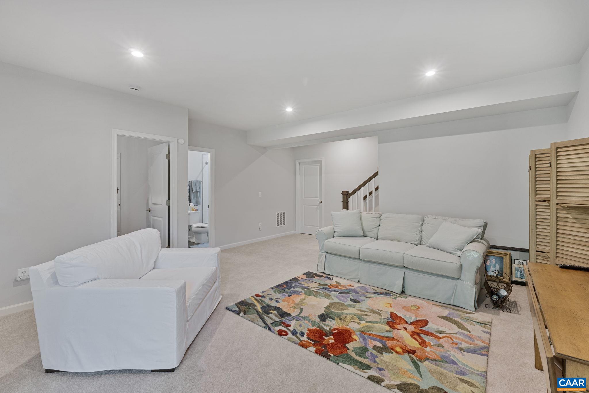 2879 Rambling Brook Lane Crozet, VA 22932 - Photo 33 of 63 a living room with furniture and a couch