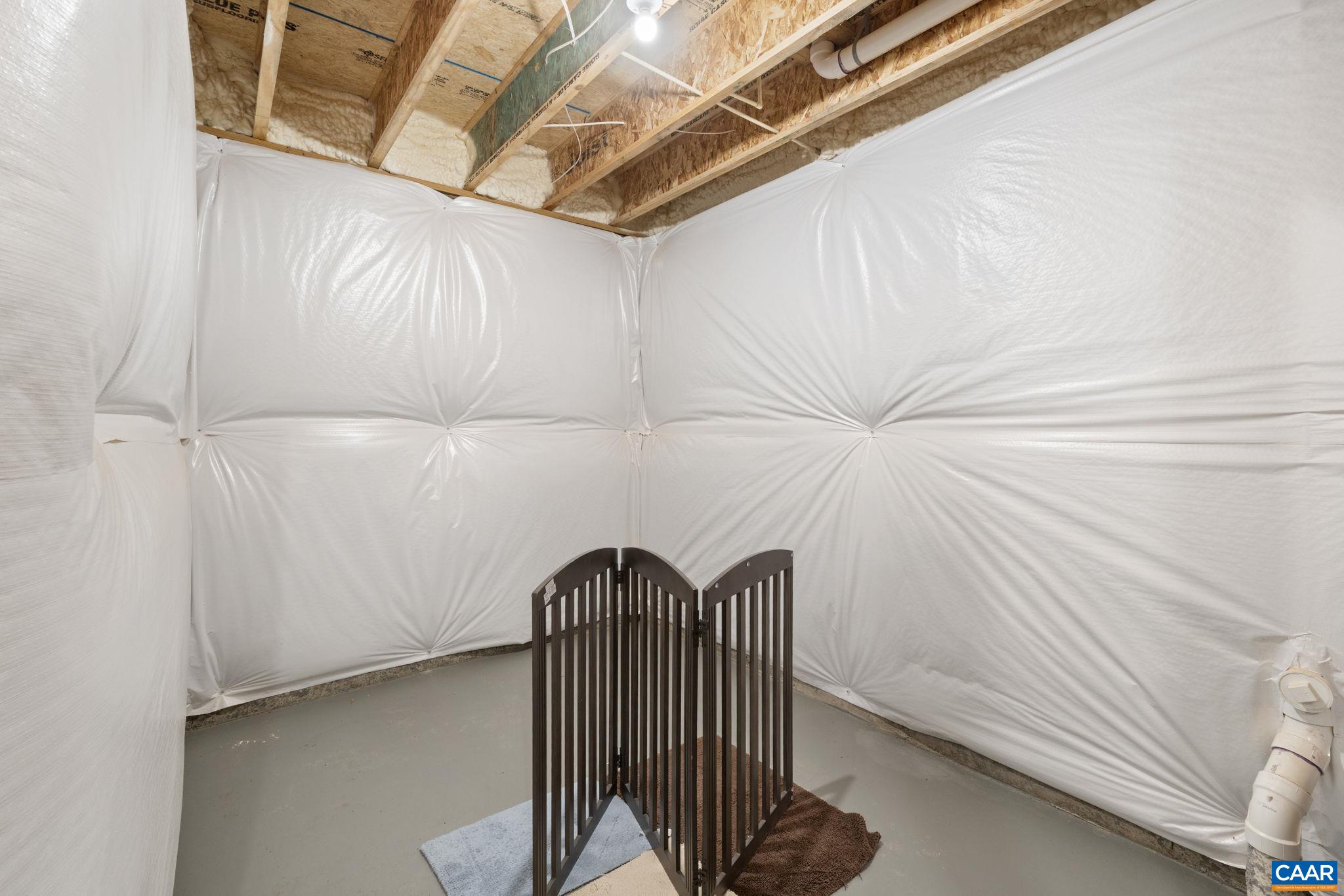 2879 Rambling Brook Lane Crozet, VA 22932 - Photo 37 of 63 a view of a room with racks on the wall