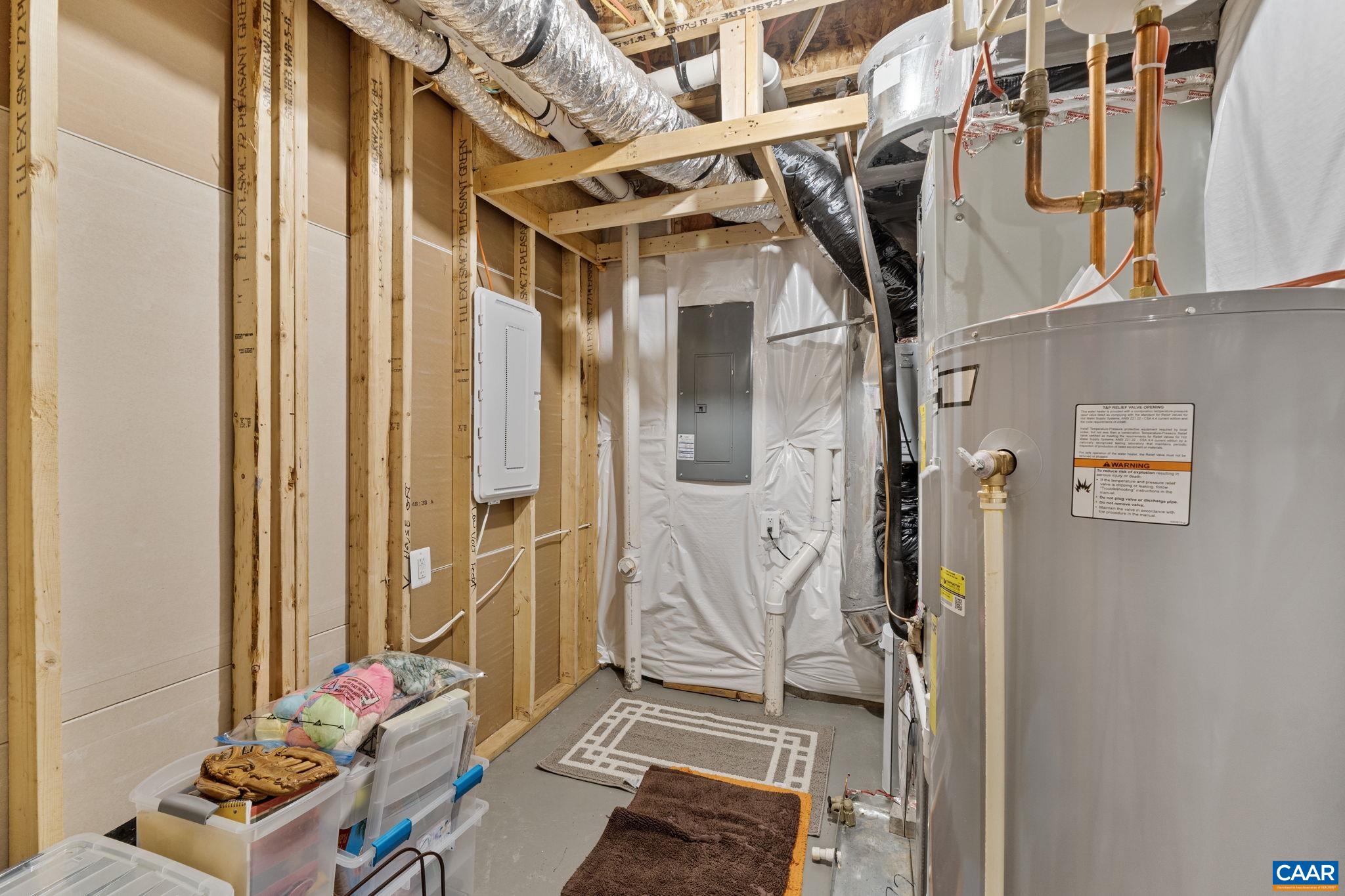 2879 Rambling Brook Lane Crozet, VA 22932 - Photo 38 of 63 a view of walk in closet with clothes and shoes
