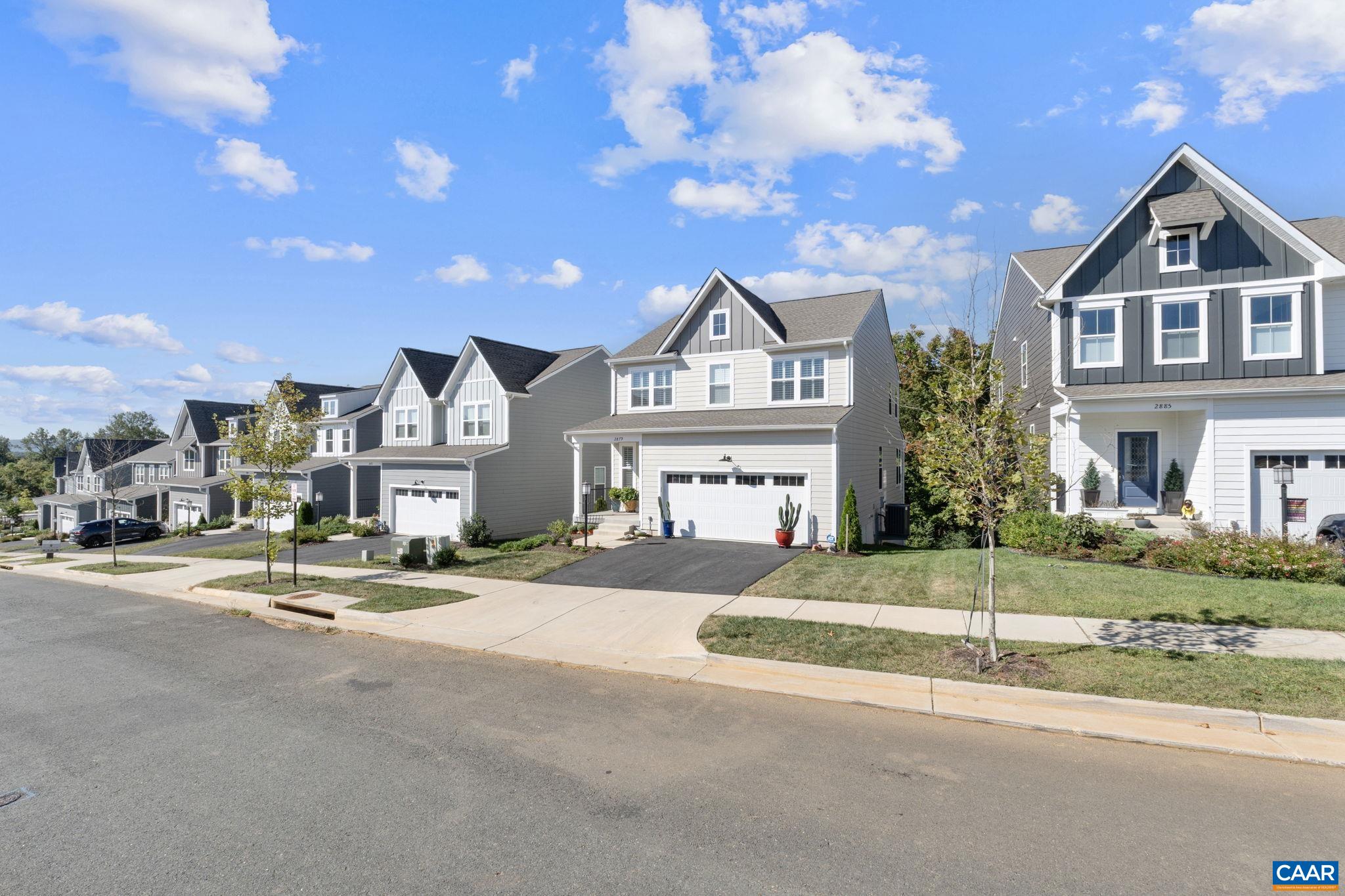 2879 Rambling Brook Lane Crozet, VA 22932 - Photo 40 of 63 a view of a house with a big yard and large tree