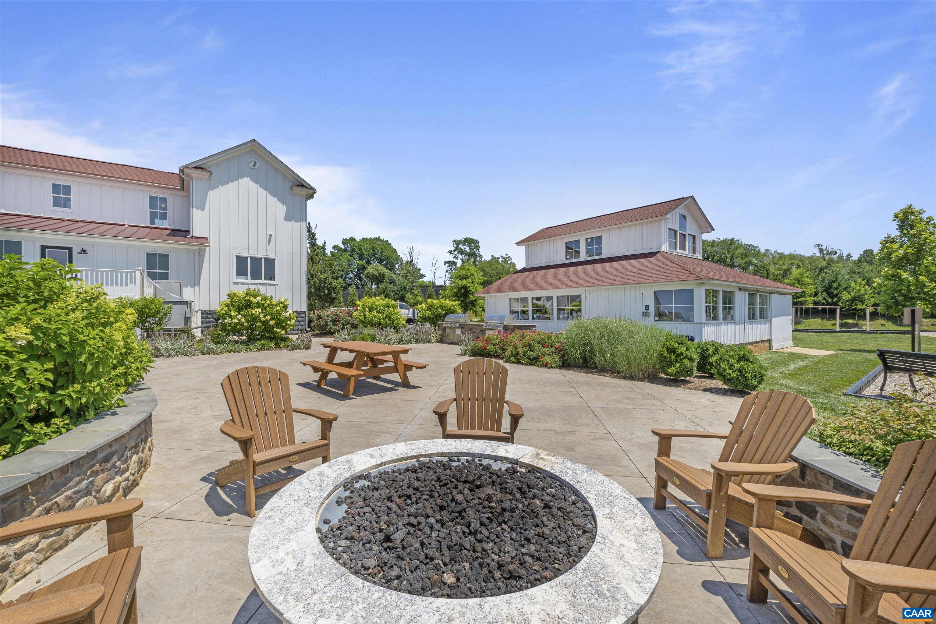 2879 Rambling Brook Lane Crozet, VA 22932 - Photo 46 of 63 a view of a house with backyard sitting area and garden
