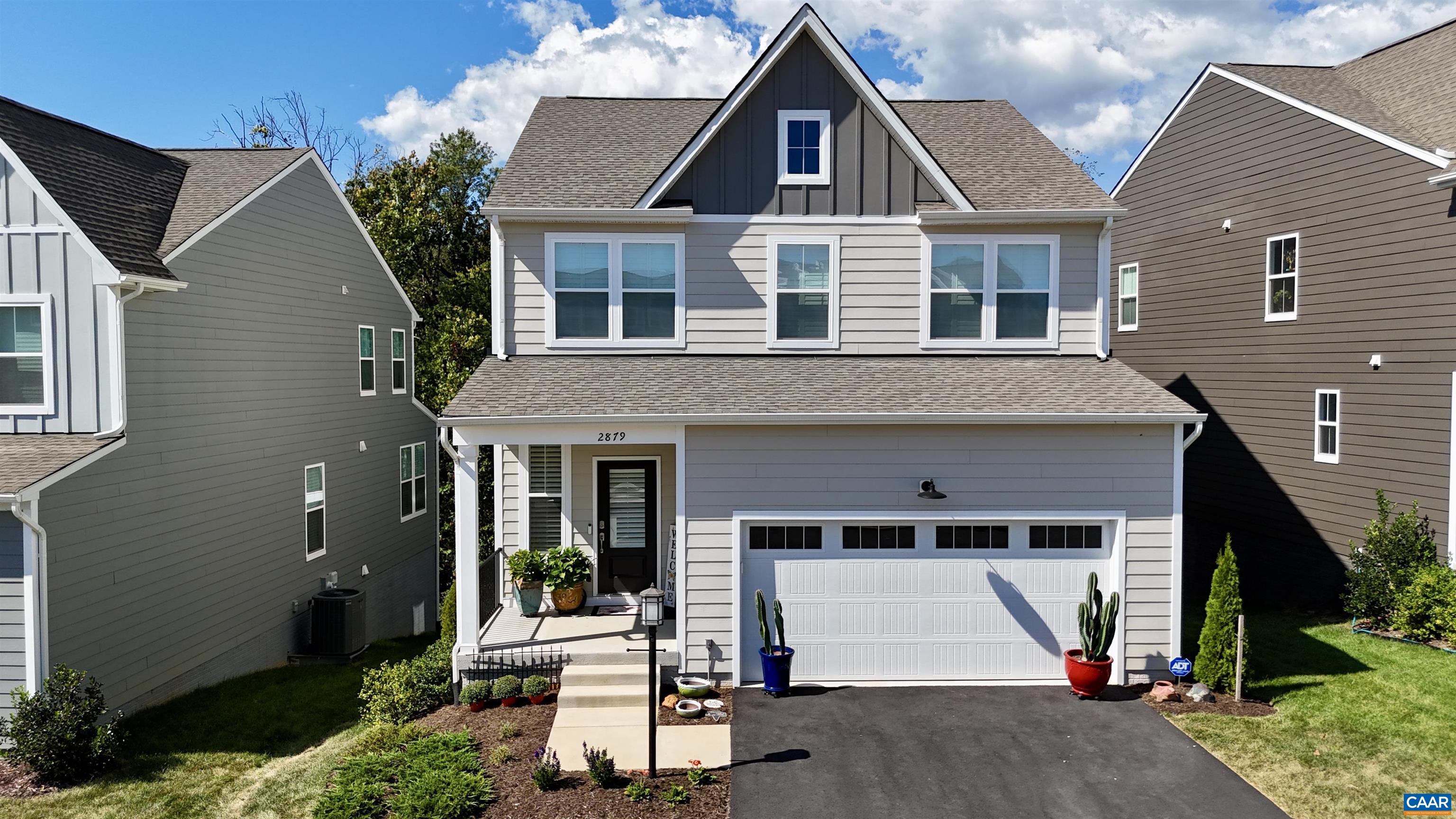 2879 Rambling Brook Lane Crozet, VA 22932 - Photo 51 of 63 a front view of a house with a yard and garage
