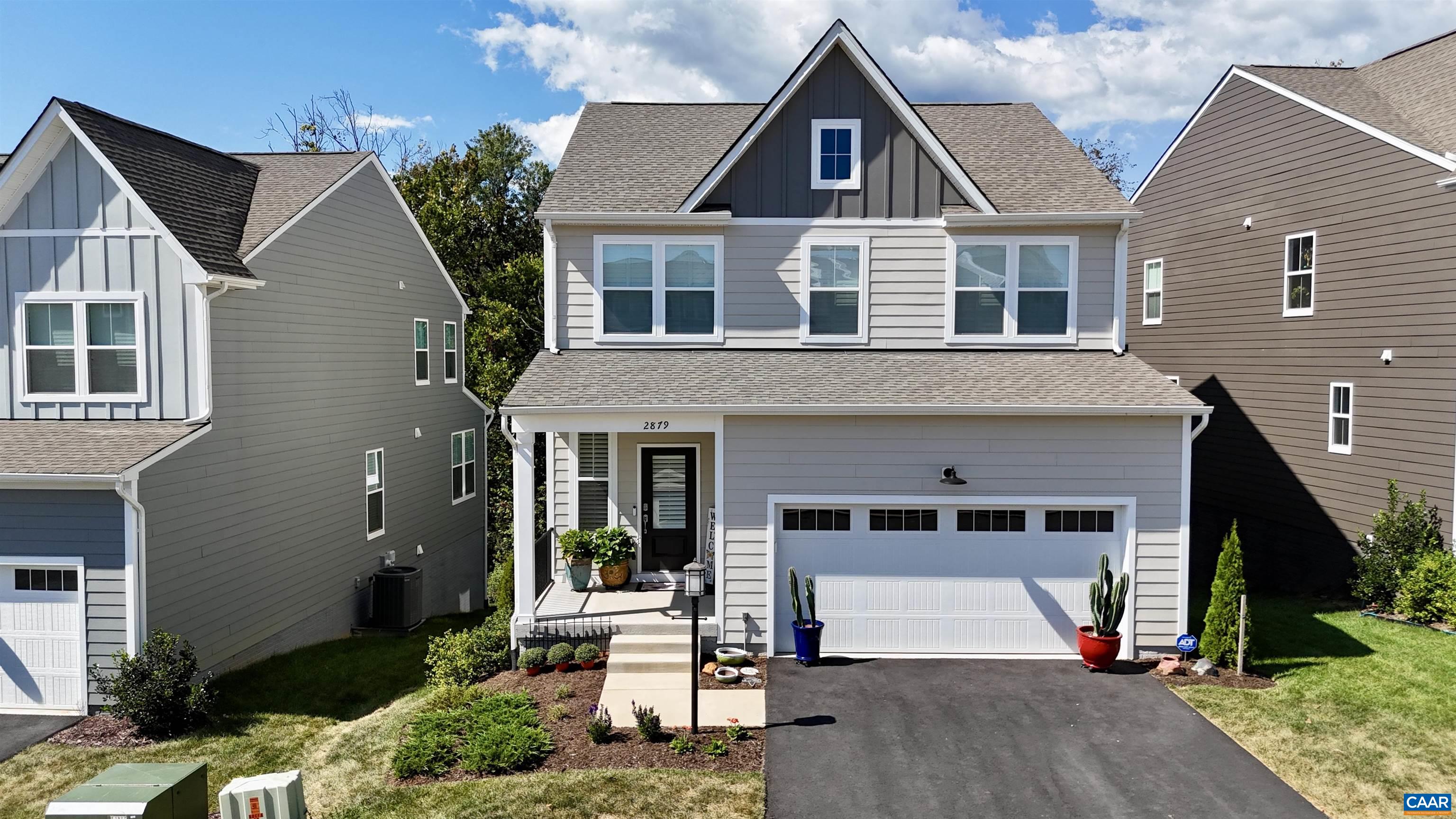 2879 Rambling Brook Lane Crozet, VA 22932 - Photo 60 of 63 a front view of a house with a yard