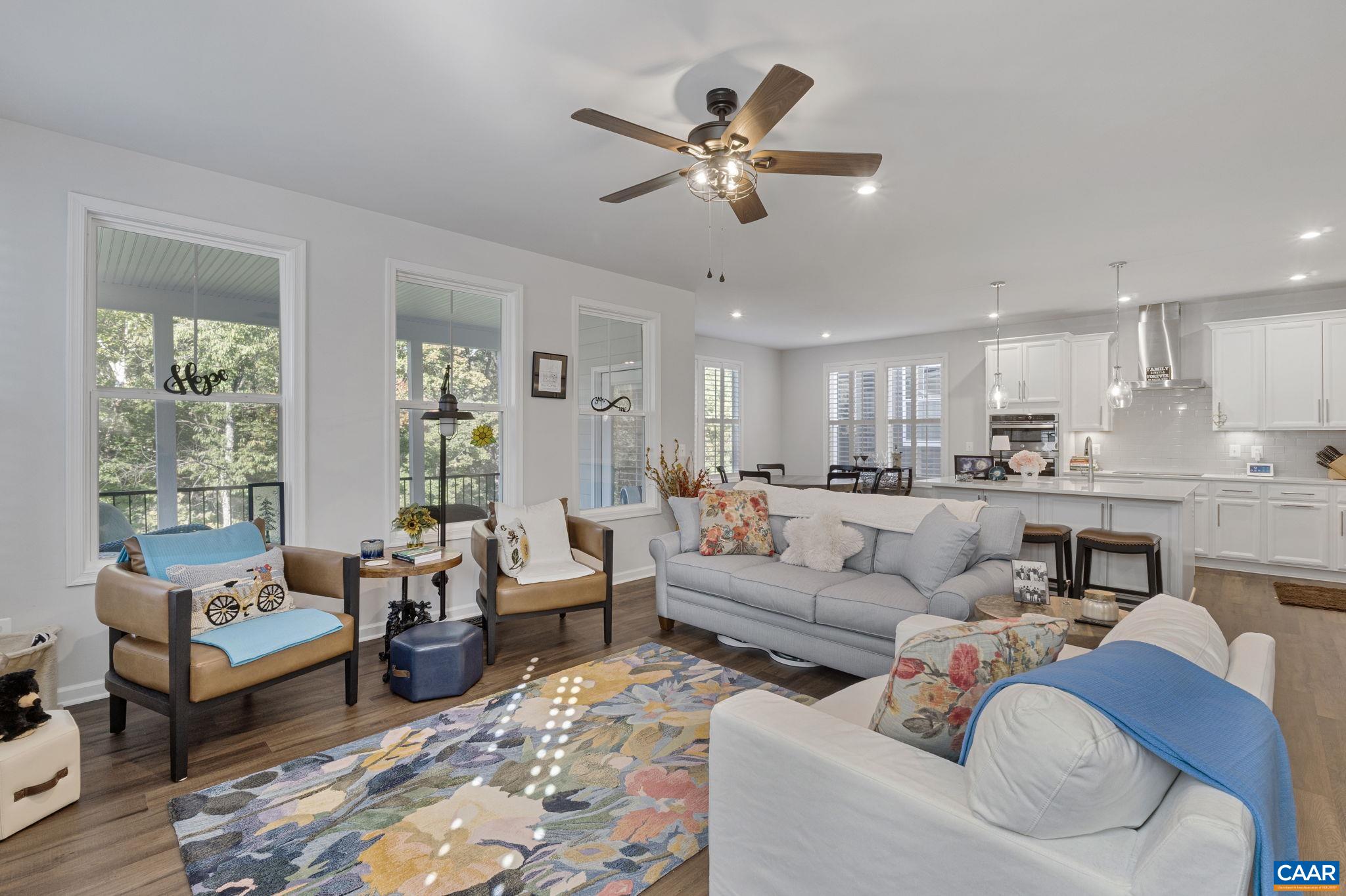 2879 Rambling Brook Lane Crozet, VA 22932 - Photo 9 of 63 a living room with furniture and a large window with wooden floor