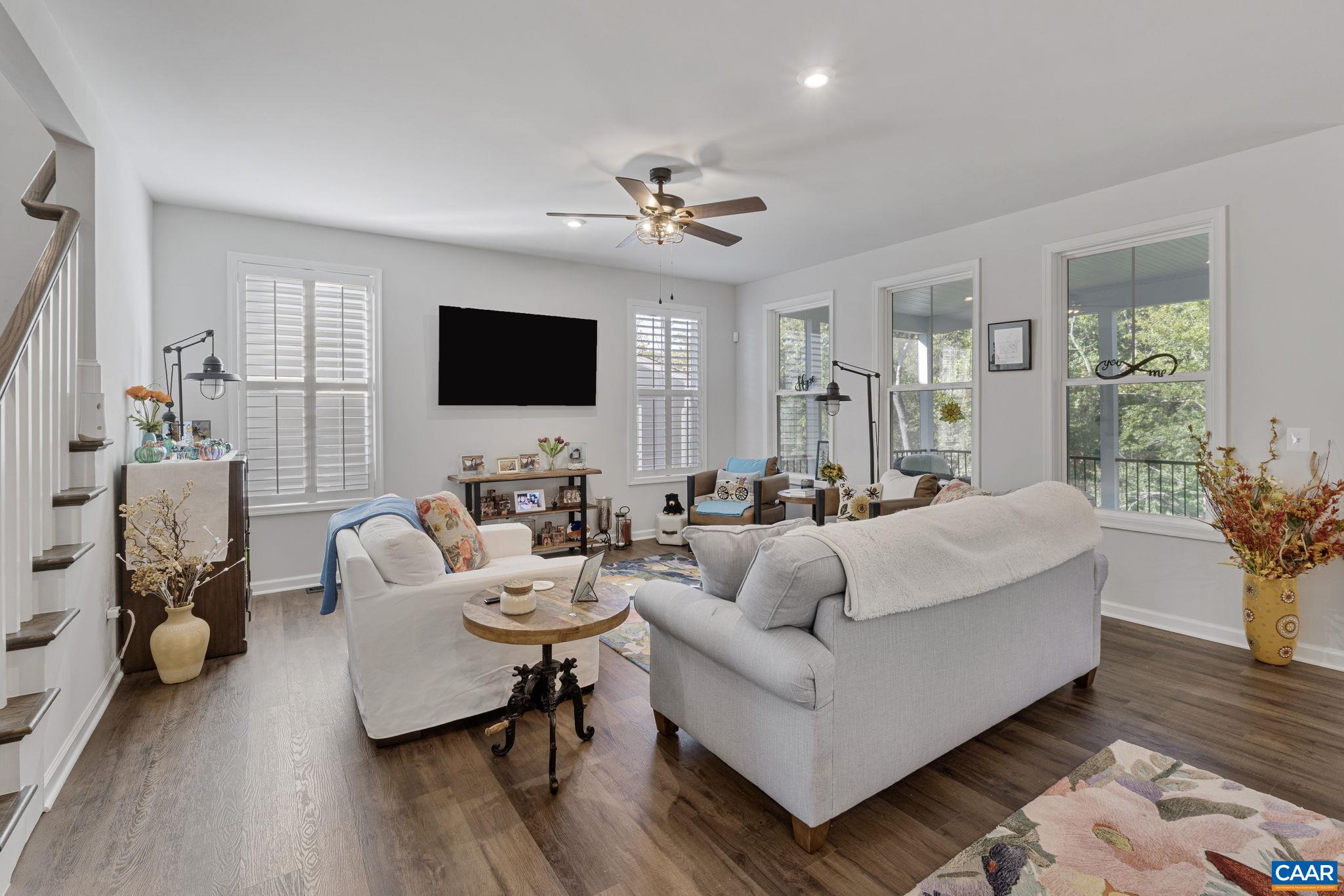 2879 Rambling Brook Lane Crozet, VA 22932 - Photo 10 of 63 a living room with furniture and a flat screen tv