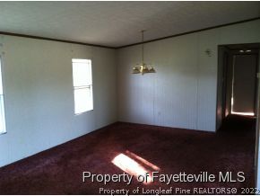 7827 Timothy Road Dunn, NC 28334 - Photo 6 of 6 a view of an empty room and window