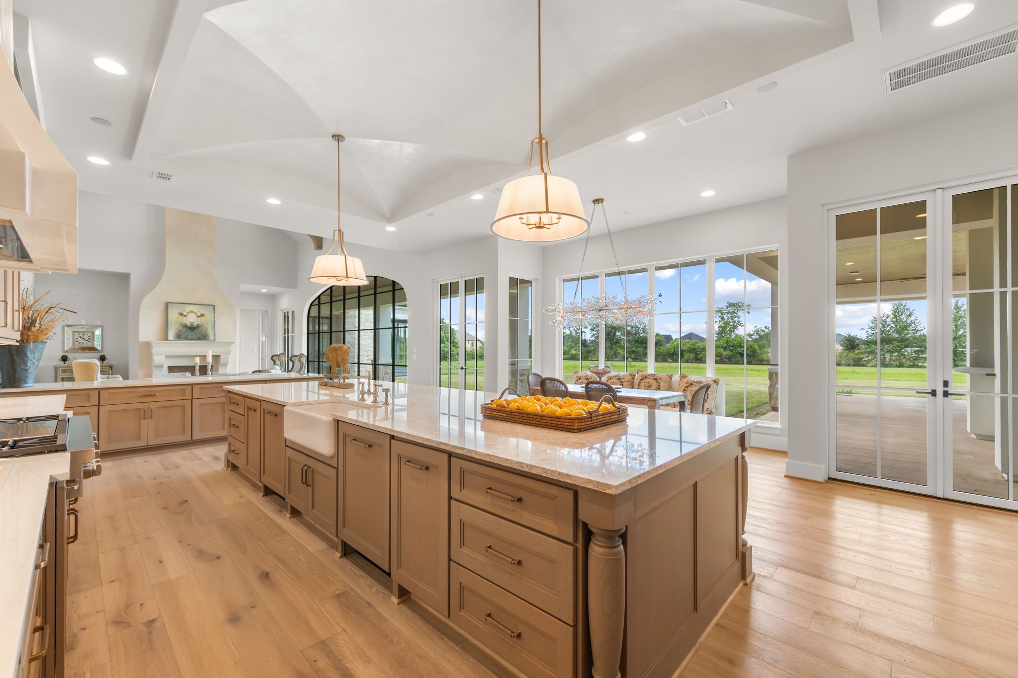 4233 Two Gun Way Katy, TX 77494 - Photo 11 of 47 Prepare meals in this stunning kitchen overlooking the beautiful breakfast room and living room with views of the rear loggia, outdoor kitchen and large backyard.