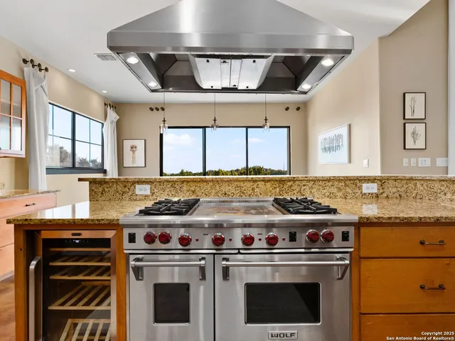 a kitchen with a stove and a sink
