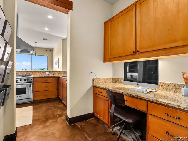 a kitchen view with cabinets stainless steel appliances and a counter space