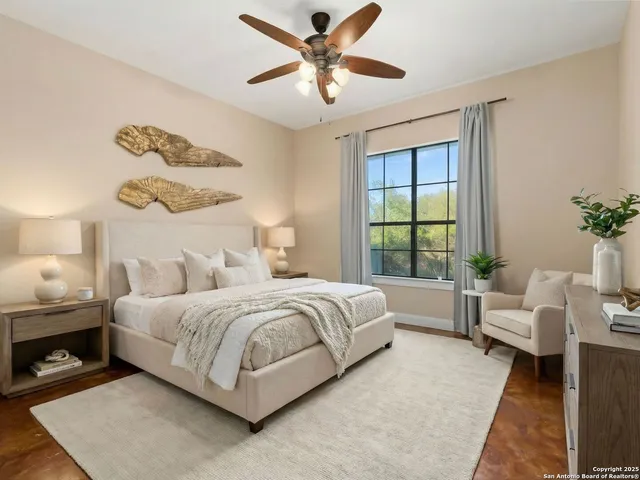 a bedroom with a bed and a couch