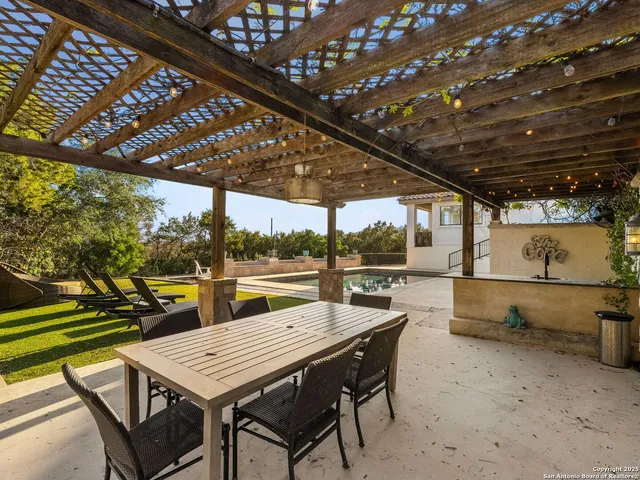 a outdoor dining space with furniture and outdoor view