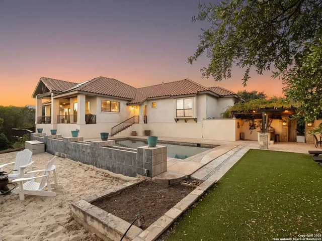 a view of a house with wooden floor and a yard