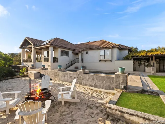 a view of a chairs and table on the terrace