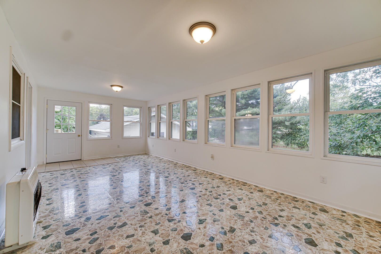 10447 North 477 East Demotte, IN 46310 - Photo 12 of 31 a view of an empty room with a window