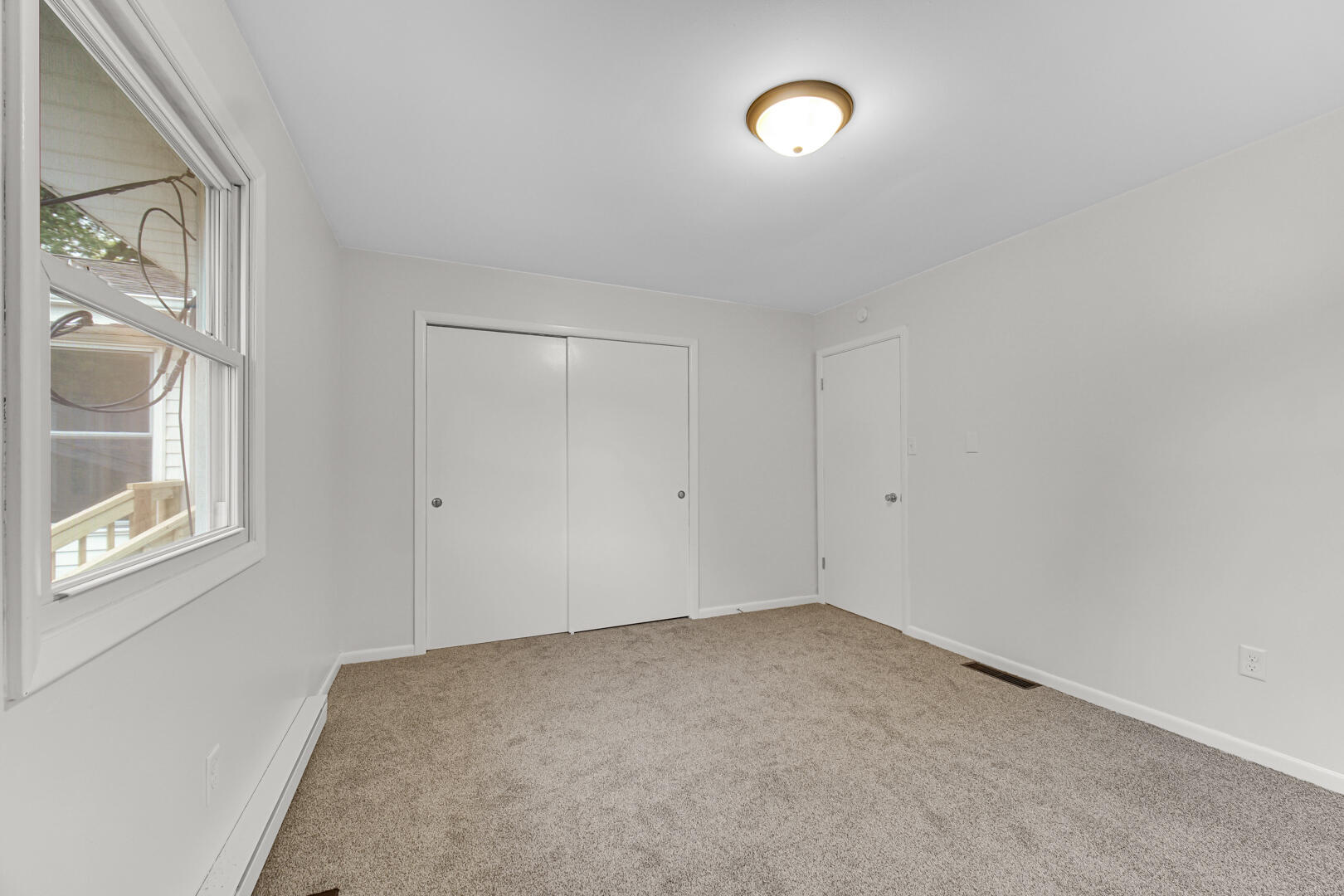 10447 North 477 East Demotte, IN 46310 - Photo 16 of 31 wooden floor in an empty room with a window