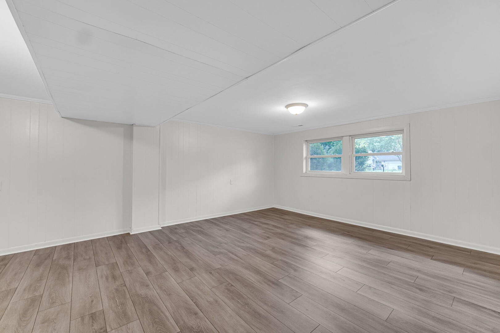 10447 North 477 East Demotte, IN 46310 - Photo 18 of 31 a view of an empty room with wooden floor and a window