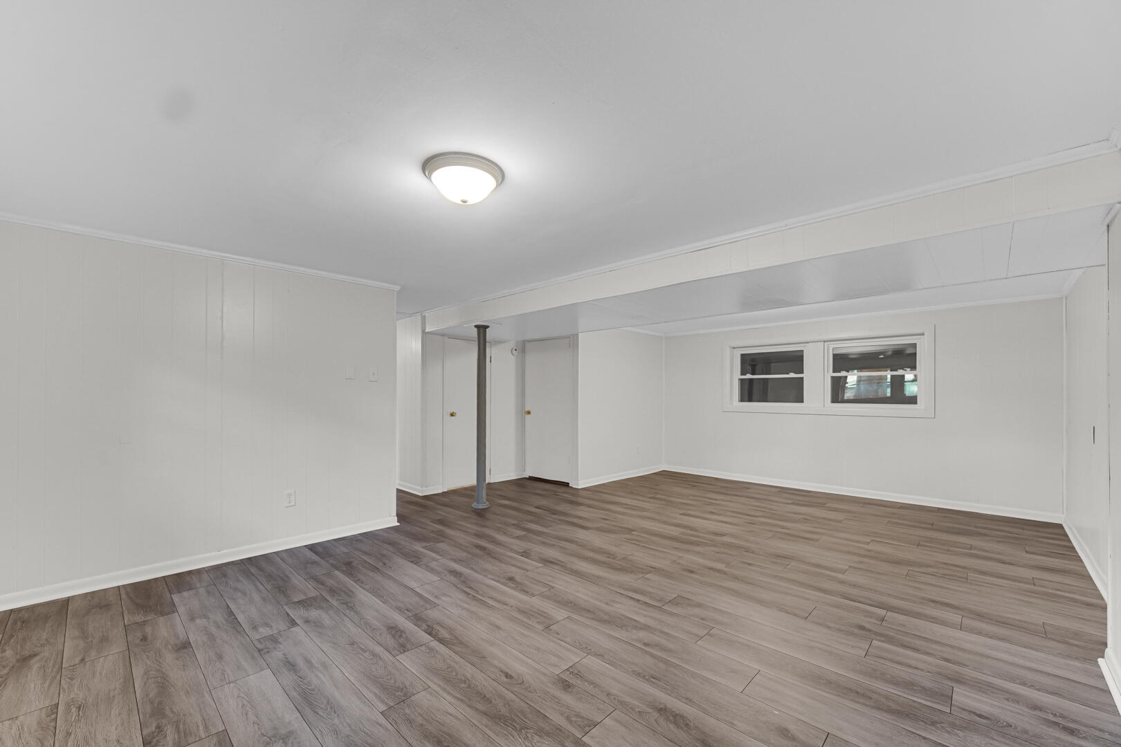 10447 North 477 East Demotte, IN 46310 - Photo 19 of 31 a view of an empty room with wooden floor and a window