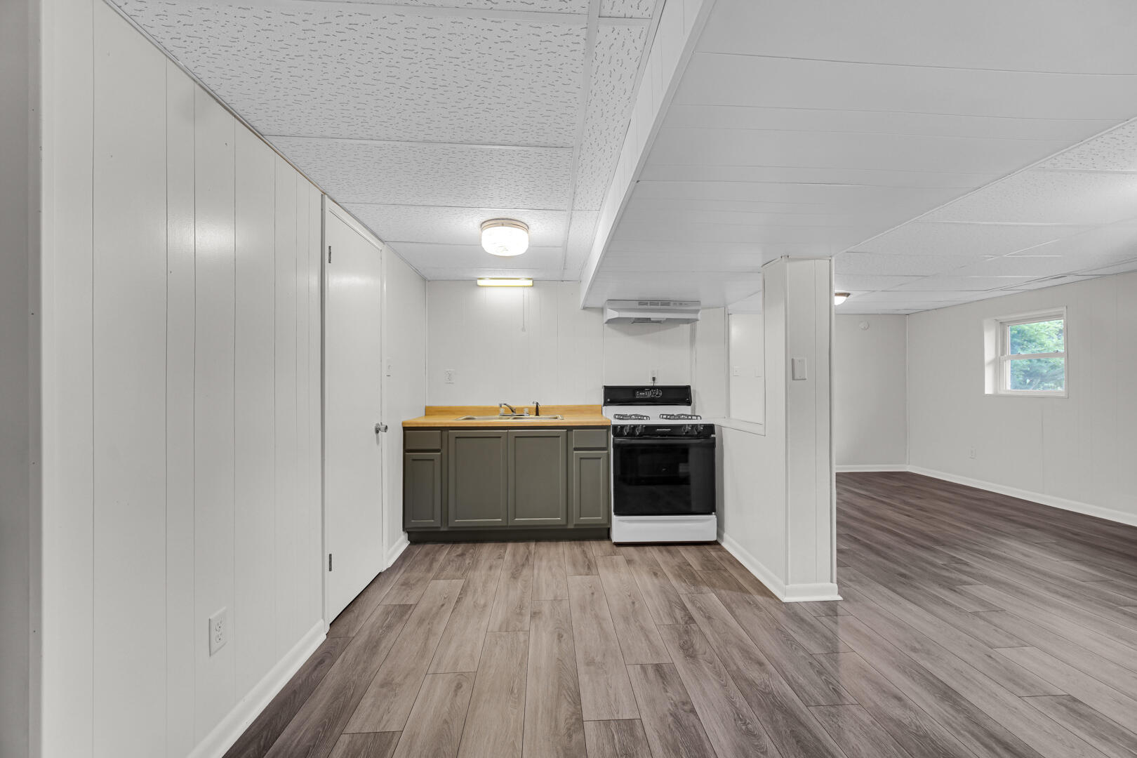 10447 North 477 East Demotte, IN 46310 - Photo 25 of 31 a view of kitchen with sink and wooden floor
