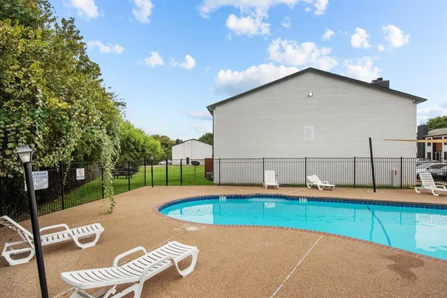a view of a house with a swimming pool