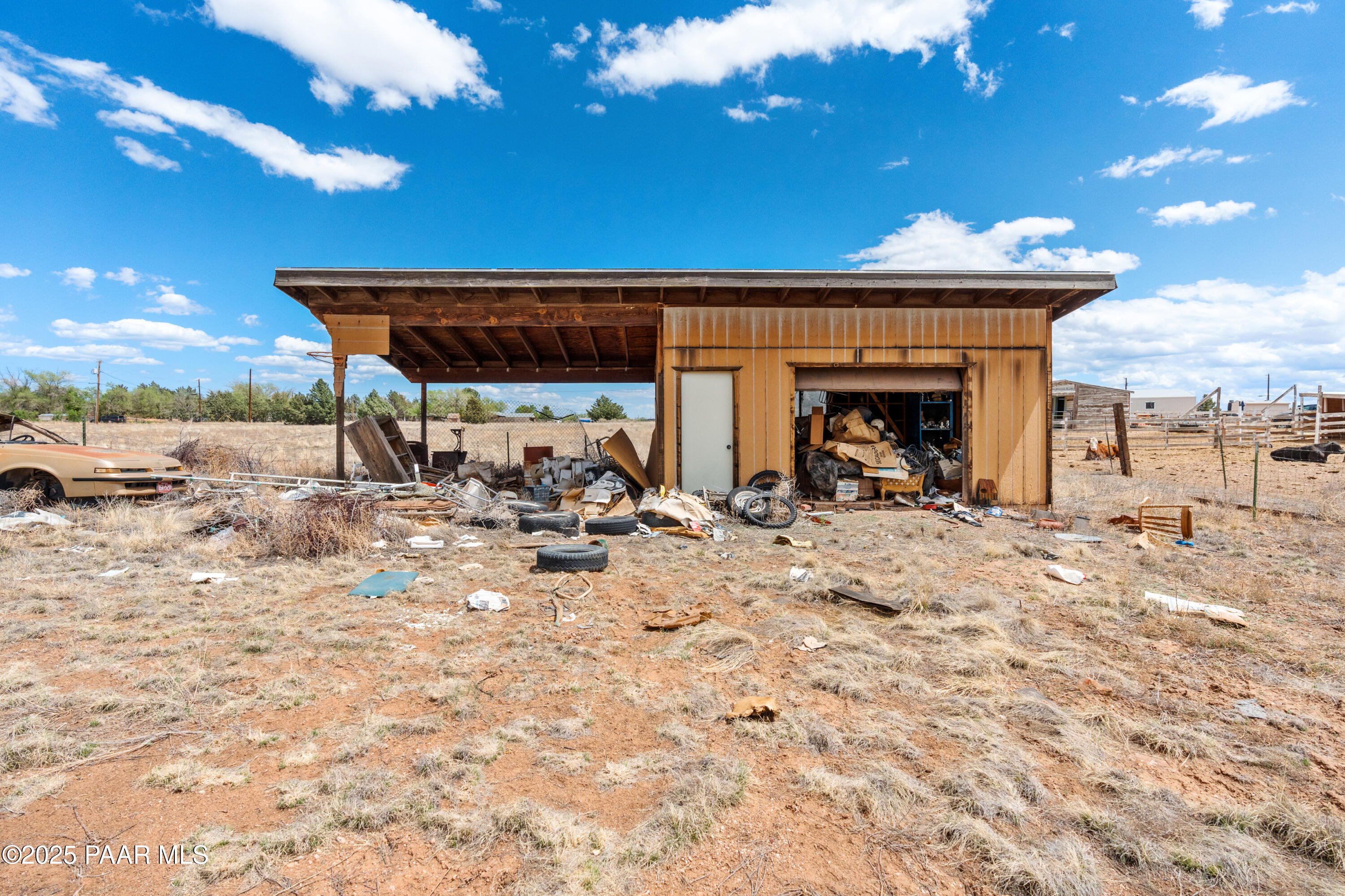 25200 North Stump Road Paulden, AZ 86334 - Photo 8 of 19 a view of a terrace with a table and chairs under an umbrella