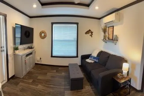 a living room with furniture and a flat screen tv