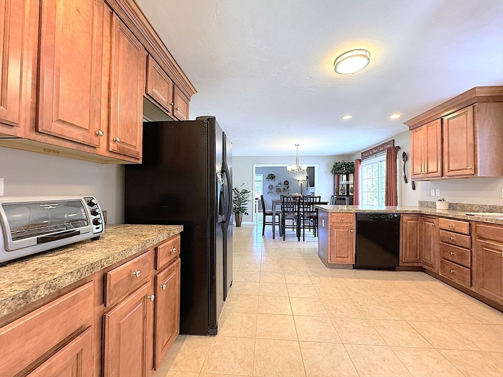 9 Noble Street Dudley, MA 01571 - Photo 12 of 41 a kitchen with a refrigerator and a sink