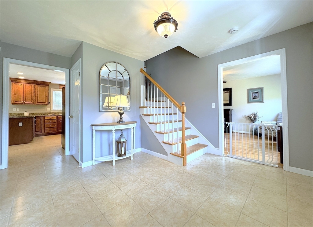9 Noble Street Dudley, MA 01571 - Photo 22 of 41 a view of a livingroom with furniture staircase and living room