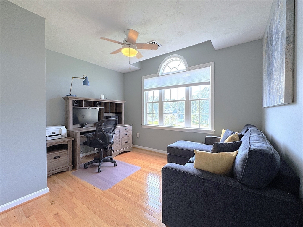 9 Noble Street Dudley, MA 01571 - Photo 25 of 41 a living room with furniture a chandelier and a window