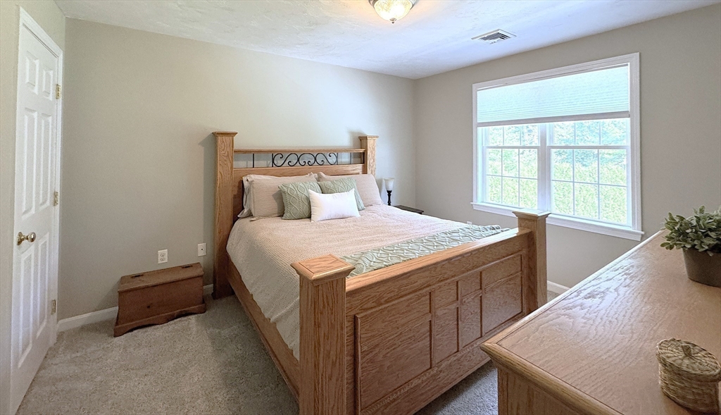 9 Noble Street Dudley, MA 01571 - Photo 26 of 41 a bedroom with a bed and a window