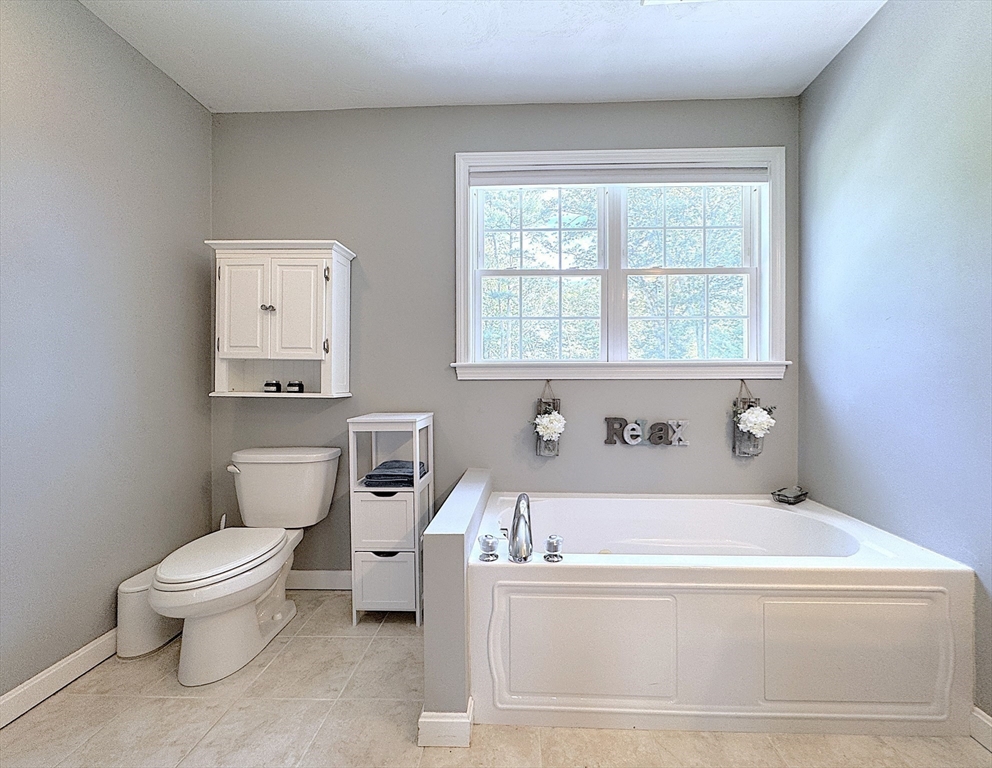 9 Noble Street Dudley, MA 01571 - Photo 31 of 41 a bathroom with a bathtub and a toilet