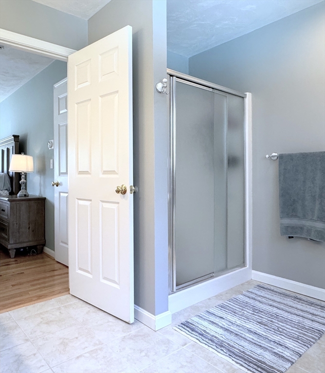 9 Noble Street Dudley, MA 01571 - Photo 32 of 41 a view of a bedroom from a hallway