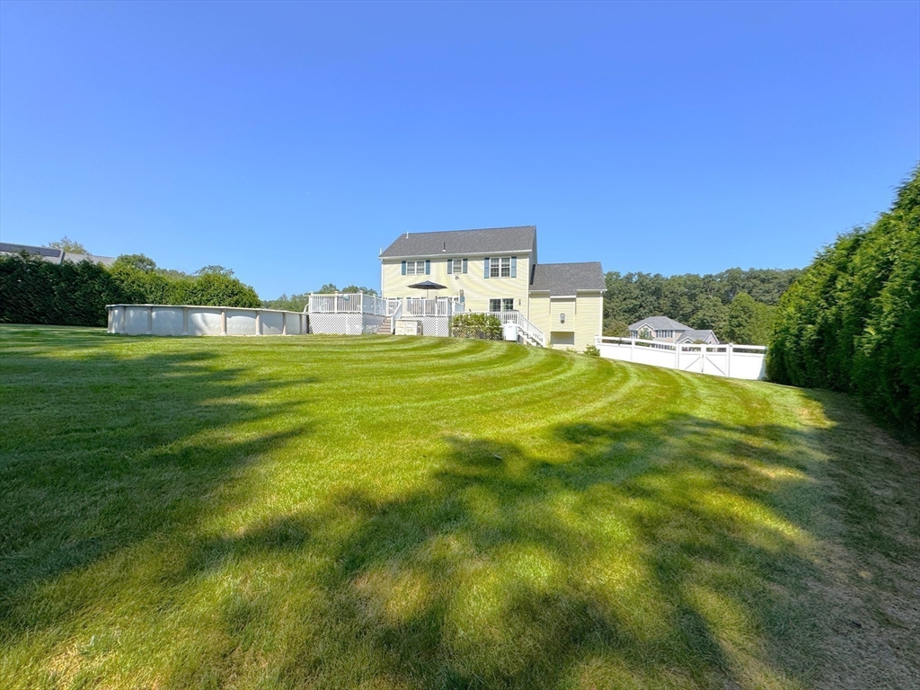 9 Noble Street Dudley, MA 01571 - Photo 37 of 41 a view of a big room with a big yard