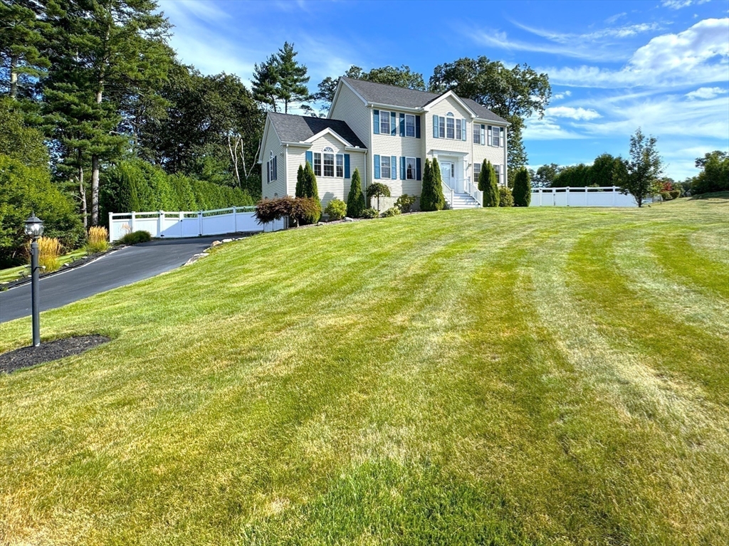 9 Noble Street Dudley, MA 01571 - Photo 40 of 41 a front view of a house with a yard
