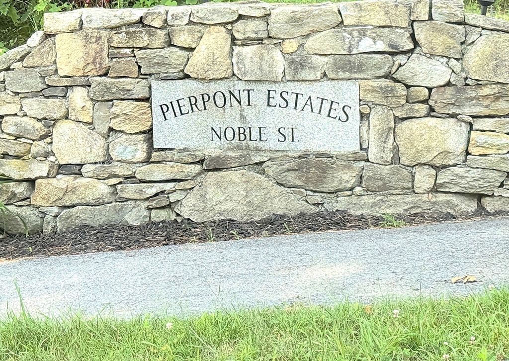 9 Noble Street Dudley, MA 01571 - Photo 41 of 41 a sign on the side of a building