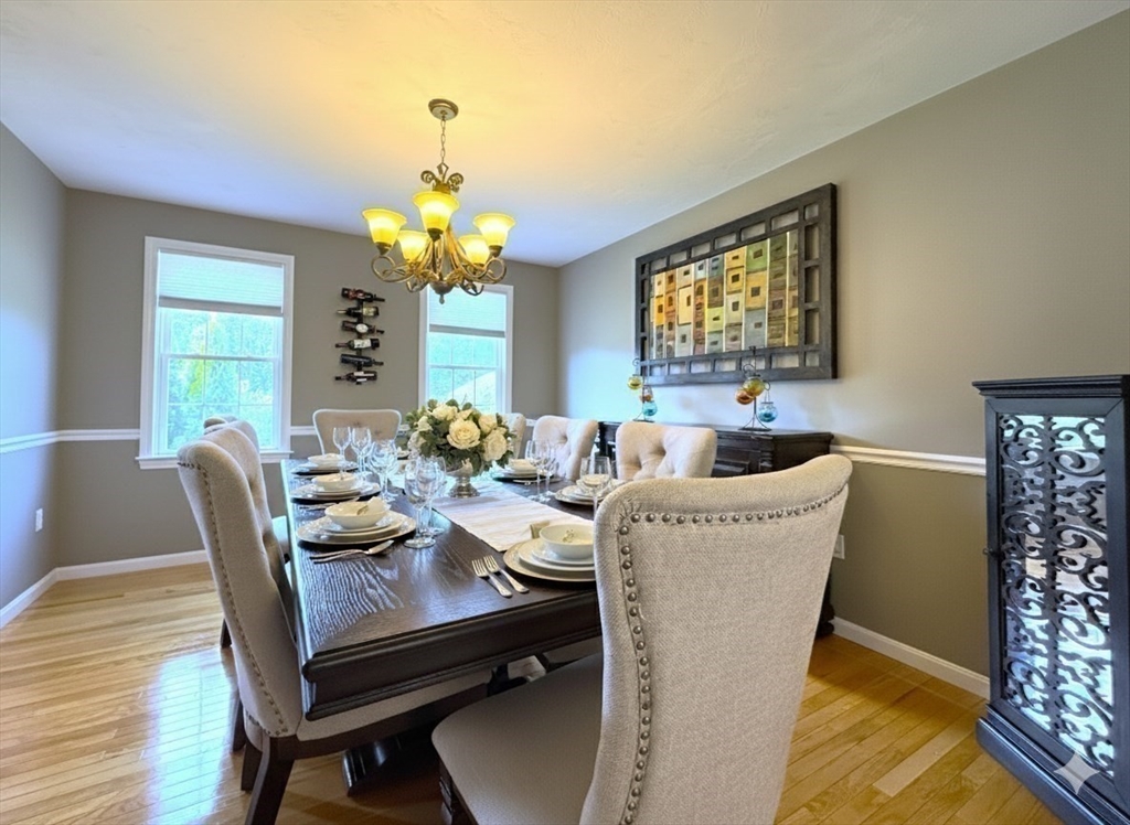 9 Noble Street Dudley, MA 01571 - Photo 7 of 41 a living room with furniture a chandelier and a window