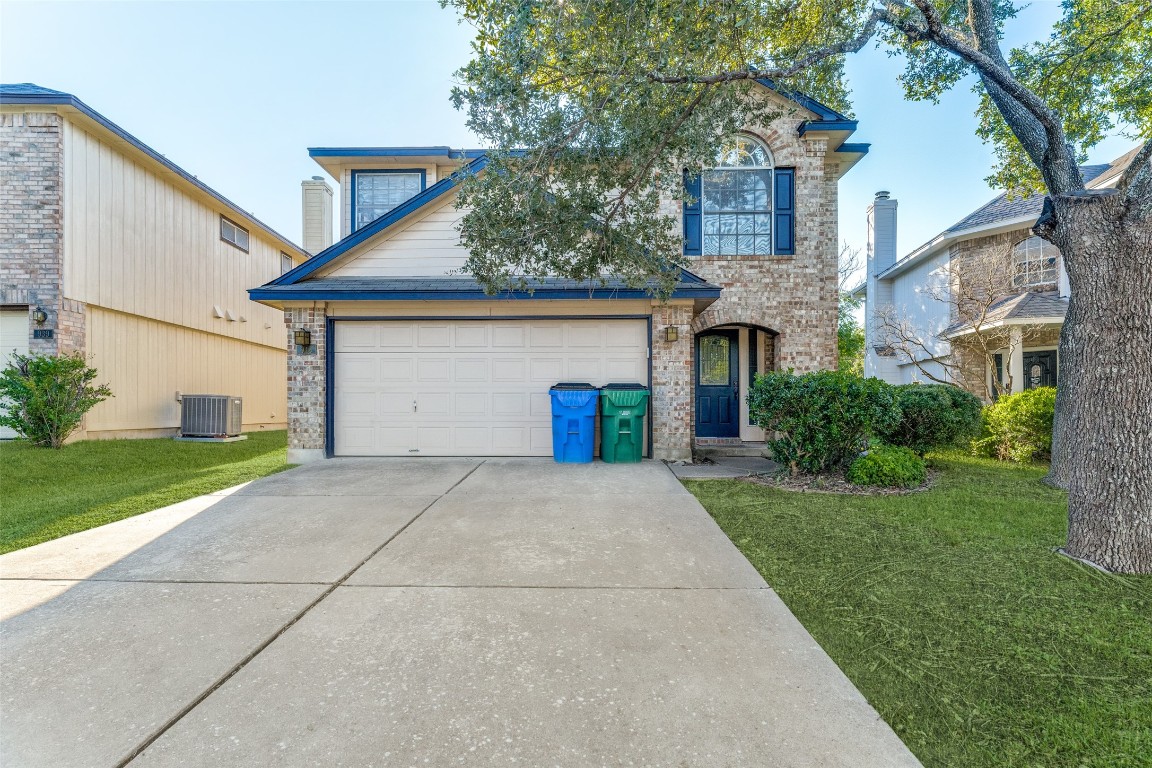943 Kirtomy Loop Pflugerville, TX 78660 - Photo 1 of 1 a front view of a house with a yard and garage