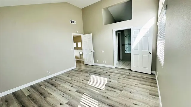 a bathroom with a granite countertop sink mirror and bathtub