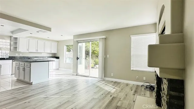 a kitchen with granite countertop a stove and a refrigerator