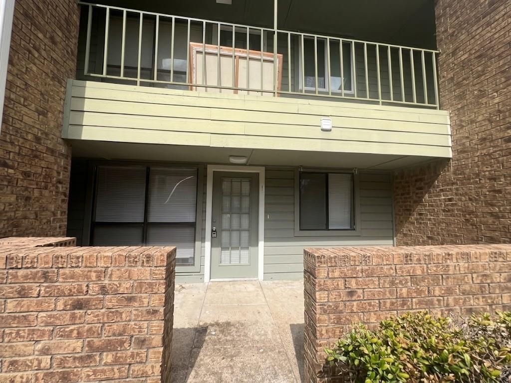 6108 Abrams Road, Unit 108 Dallas, TX 75231 - Photo 14 of 16 Brick veneer exterior with horizontal siding accents