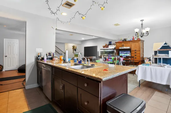 a kitchen that has a lot of cabinets in it
