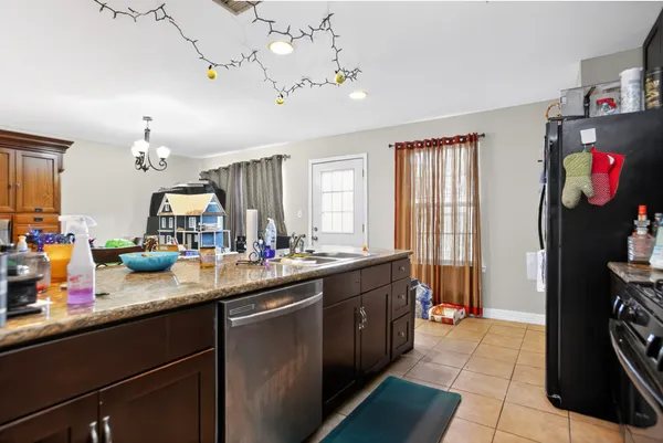 a kitchen with sink and cabinets