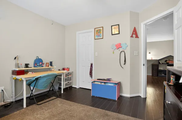 a bed room with a bed and a desk