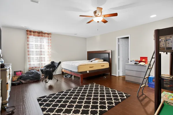 a bedroom with furniture and a window