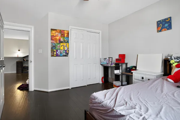 a bedroom with a bed and a tv in it
