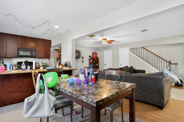 a view of kitchen dining table and chairs